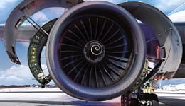 Roda de um avião com cores em azul, cinza e rosa em espiral, ilustrando o uso dos lubrificantes Mobil em produtos de alta tecnologia